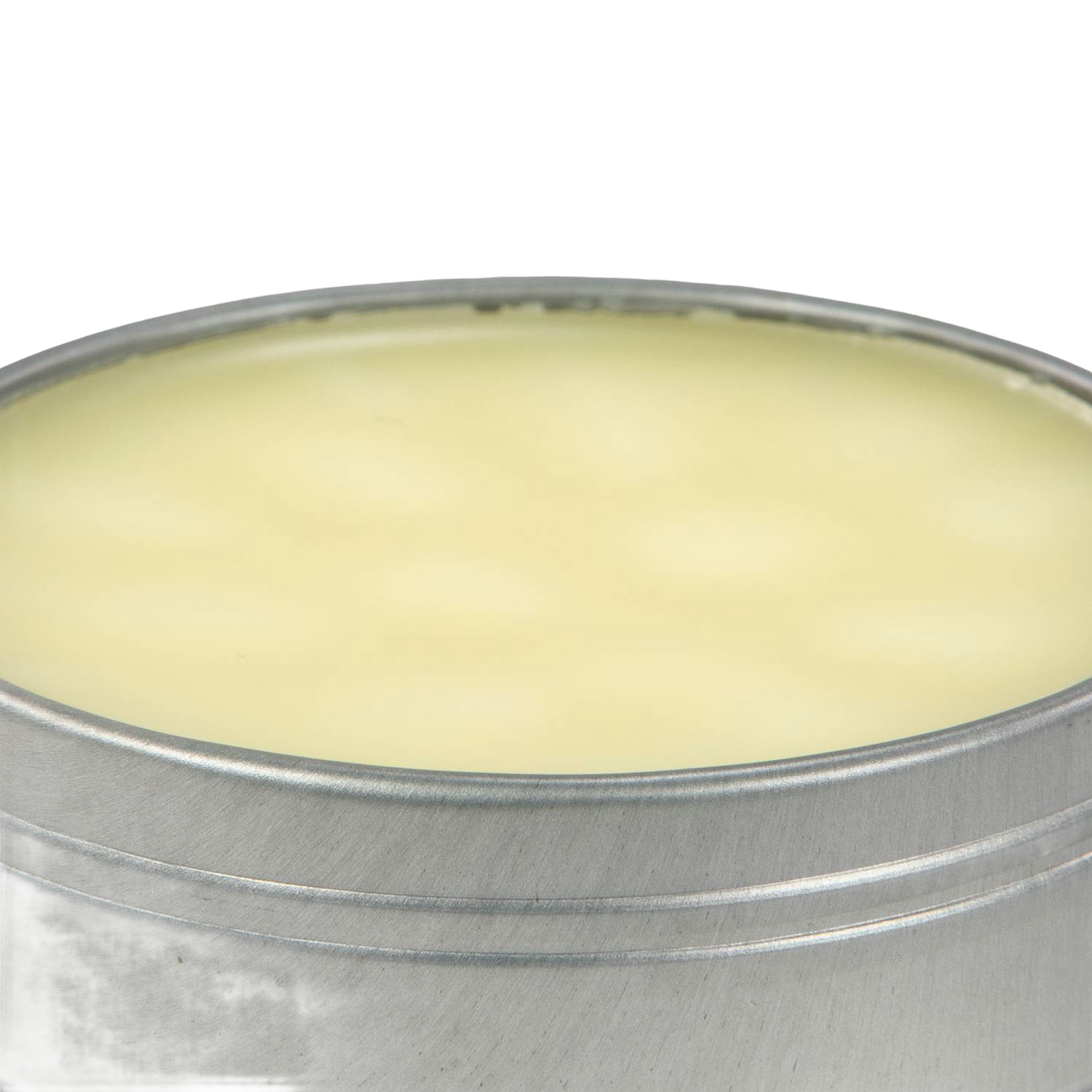 Open metal tin filled with pale yellow cast iron seasoning wax, in Kitchenware under $50 collection