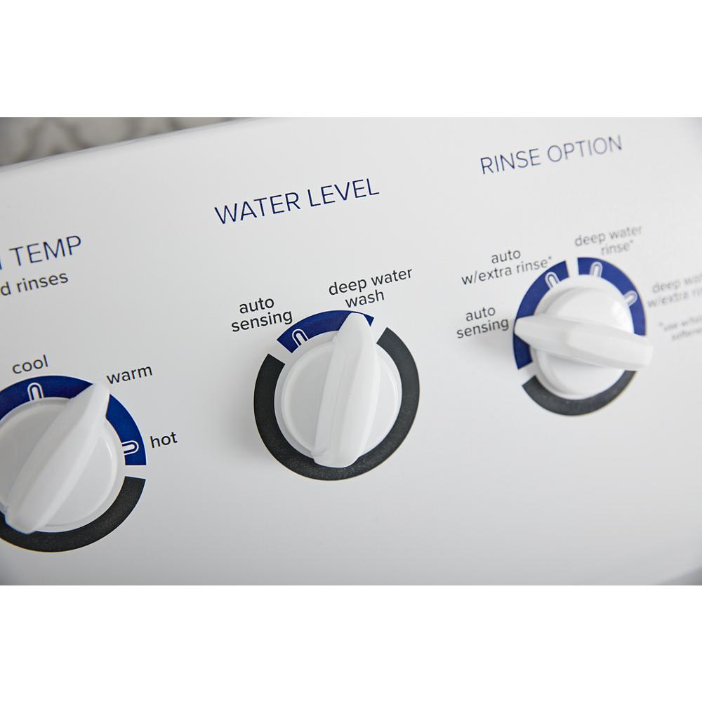 Close-up of white washer control panel with water level and rinse option dials from top load washers collection