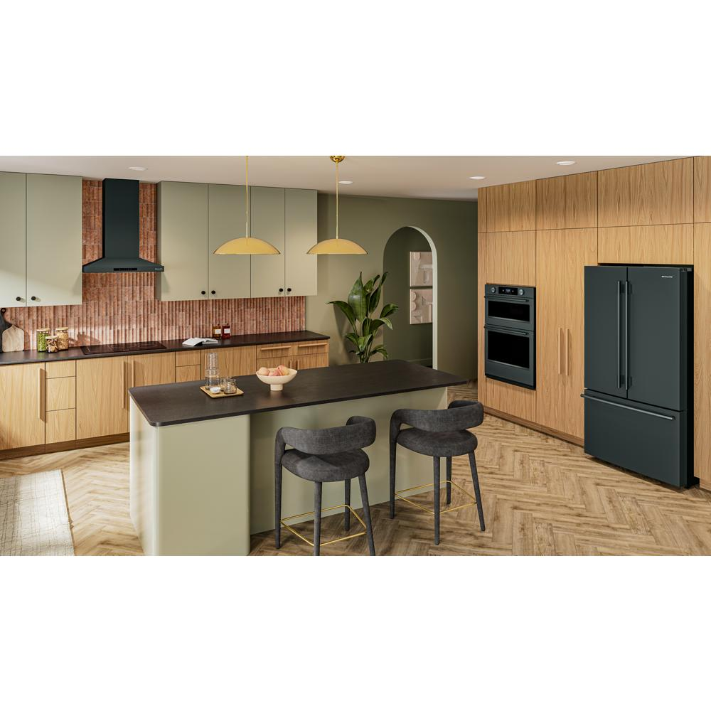 Contemporary kitchen with matte black wall-mount canopy hood, sage green cabinets, wood accents, and modern appliances