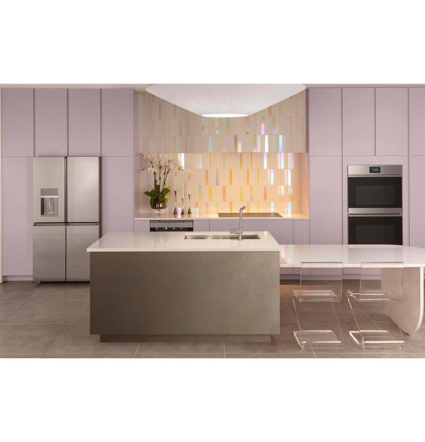 Minimalist kitchen with lavender cabinetry, stainless appliances, custom LED-lit insert, and transparent dining chairs