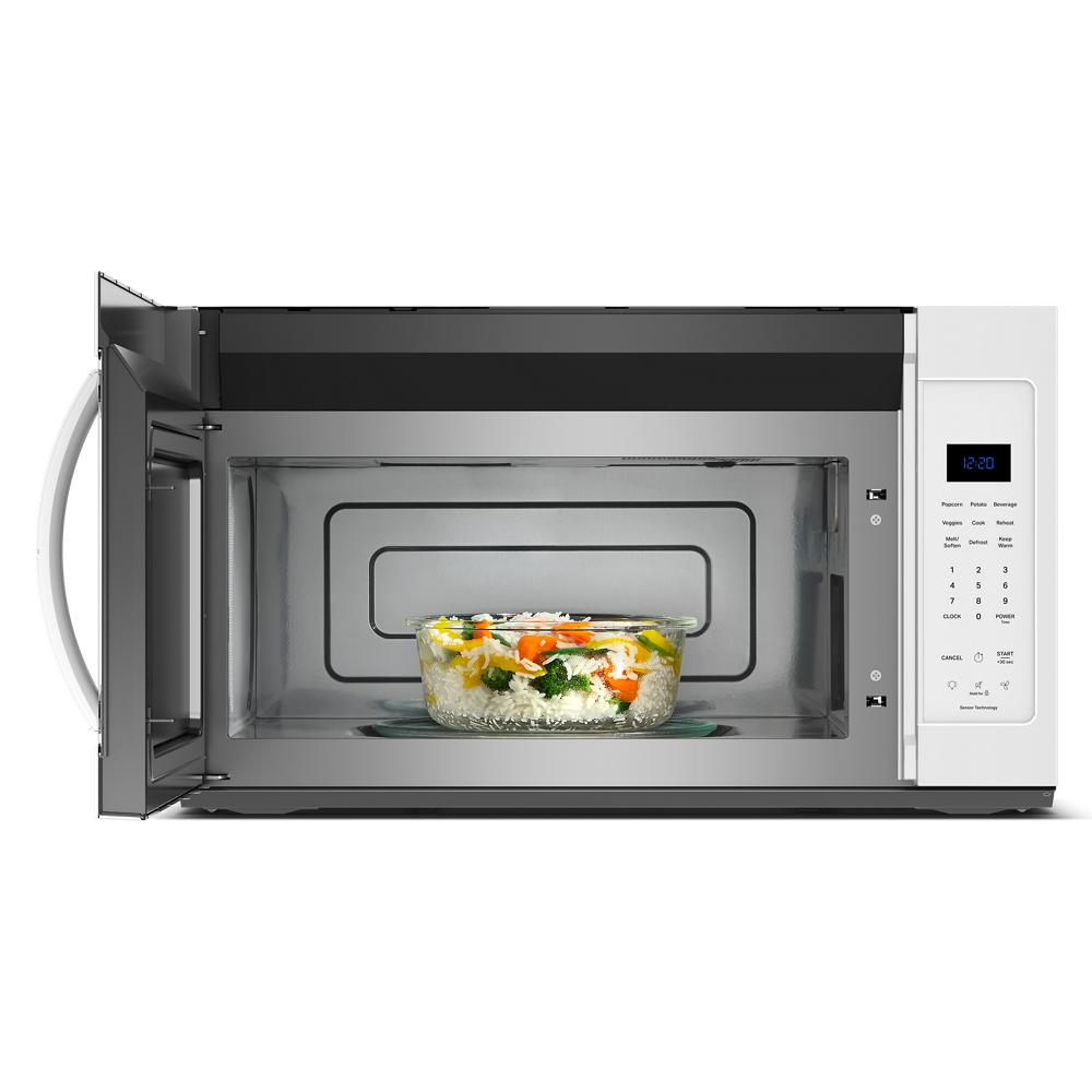 Over the range microwave with open door and cooked vegetable dish inside, part of kitchen appliances and microwaves collections