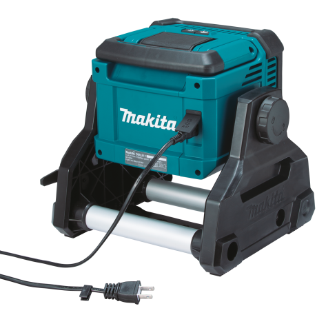 Compact teal and black Makita cordless and corded work light with adjustable handle for tool and lighting collections