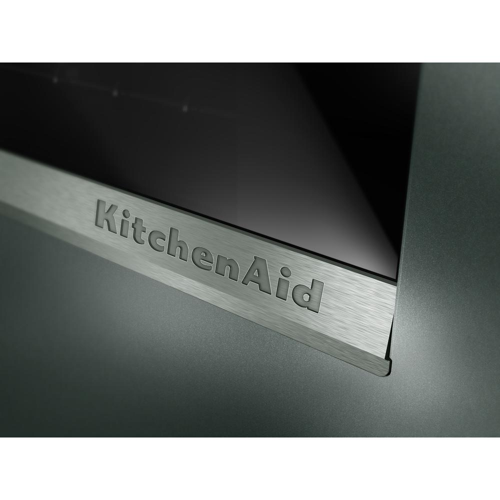 Close-up of stainless steel trim with KitchenAid logo on a smart electric single wall oven in Appliances collection