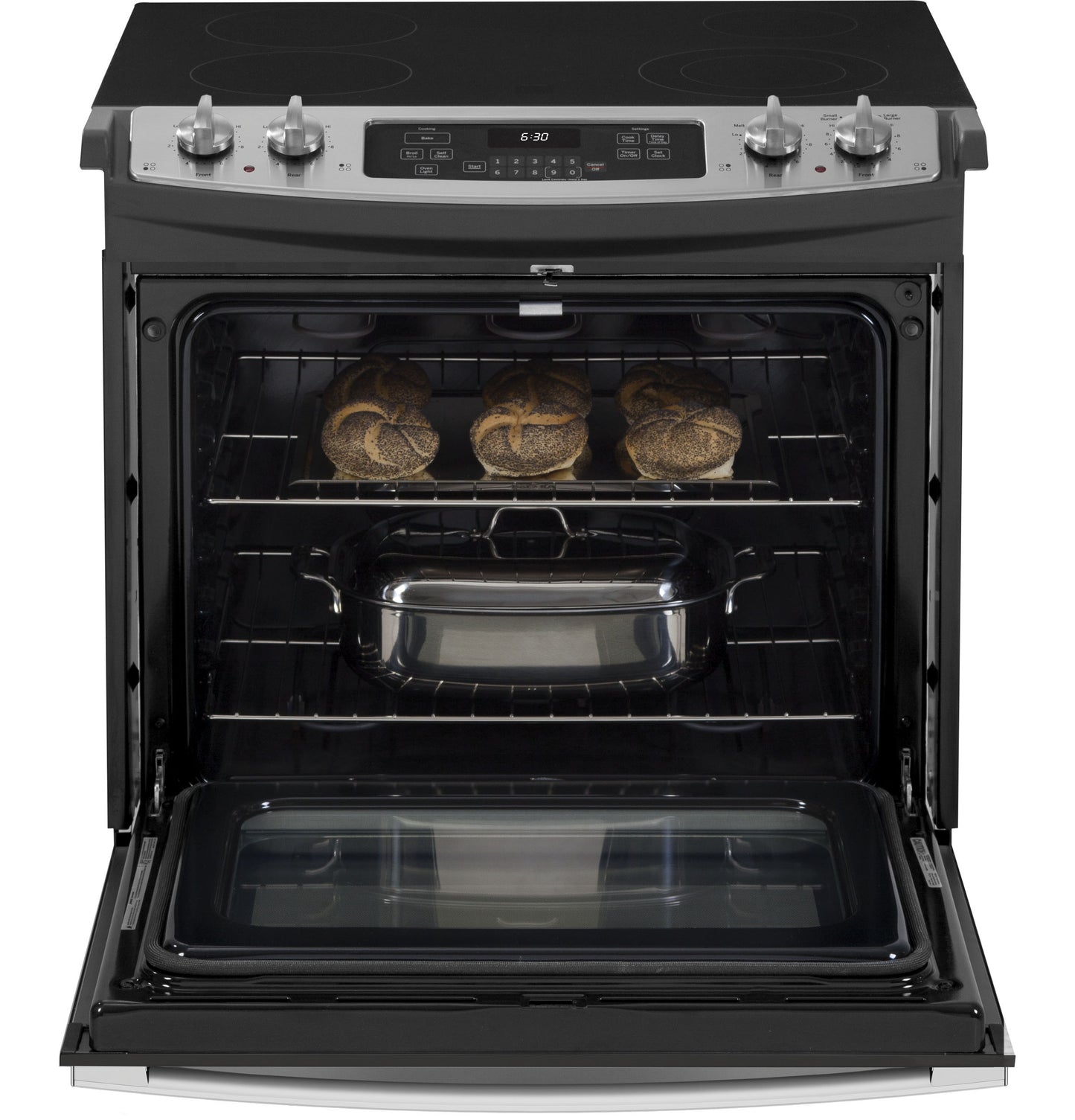 Open drop-in electric range with black glass cooktop, stainless steel control panel, and food baking inside oven door open