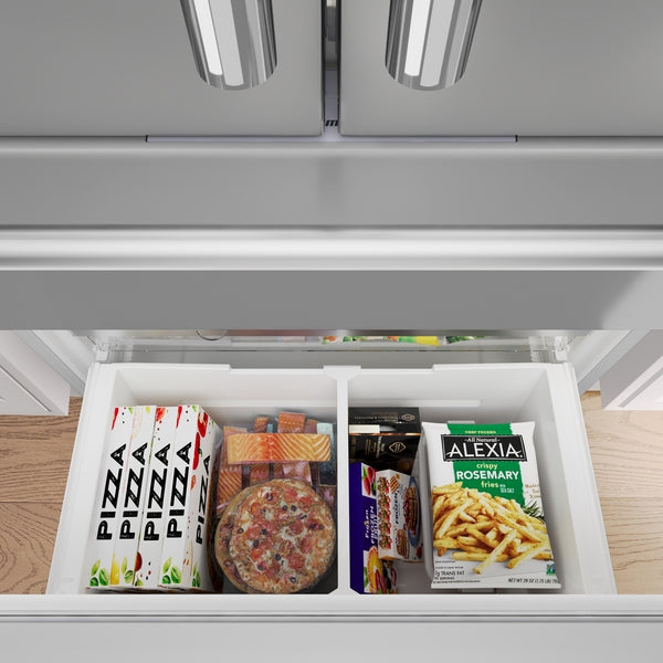 Open bottom freezer drawer with organized frozen pizzas, salmon, snack bars, and seasoned frozen fries in stainless steel refrigerator