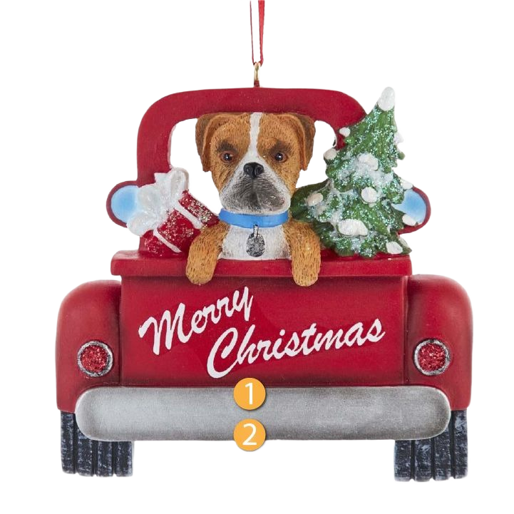 Red Christmas ornament featuring a Boxer dog in a festive red truck with tree and gifts decoration