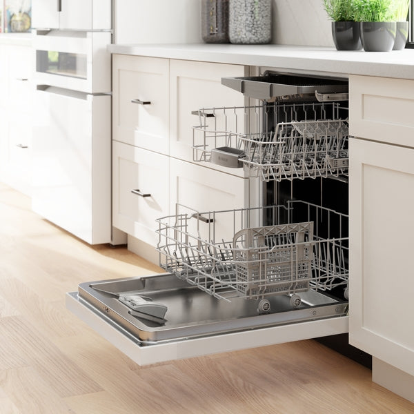 Built-in white dishwasher with open door and empty racks in a bright modern kitchen setting from dishwashers collection