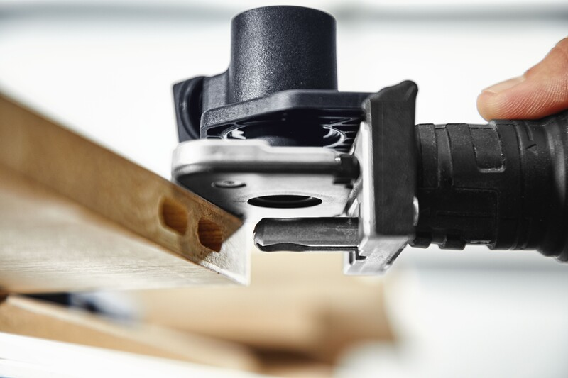 Close-up of drilling template accessory aligning a drill for precise pocket hole joinery in woodworking tool collections