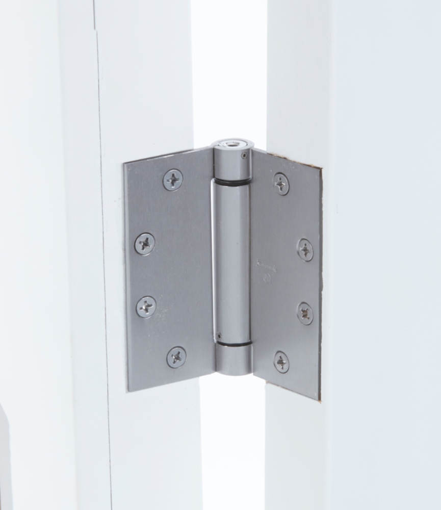 Brushed metal spring hinge with patented ratchet and multiple screws for automatic door closing and home improvement projects