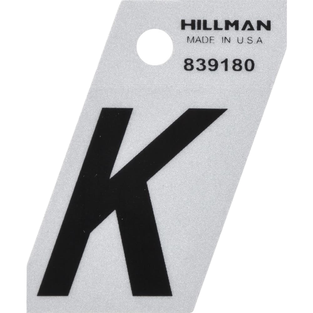 Black reflective Mylar sticker letter K with angle cut on white backing for home improvement use