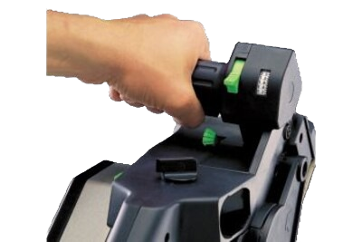 Hand gripping the black and green Festool planer for precise woodworking and home improvement tasks