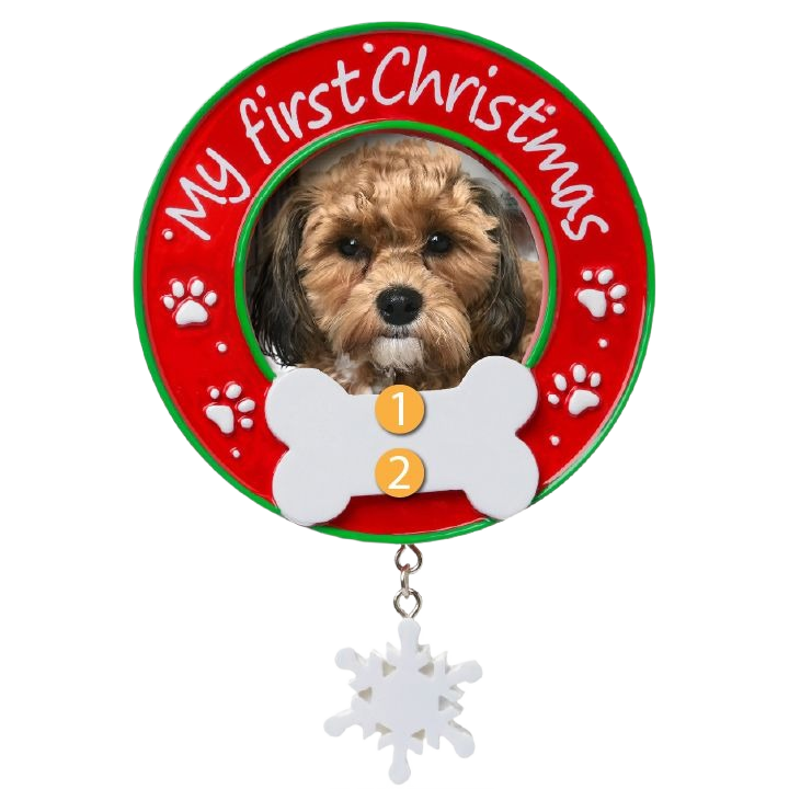 Red and green circular dog ornament with paw prints, "My first Christmas" text, white bone, and hanging snowflake decor under $50