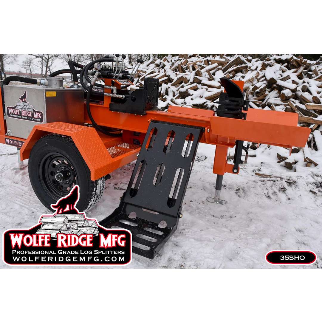 Orange commercial log splitter with hydraulic system and steel components on snowy ground near stacked firewood