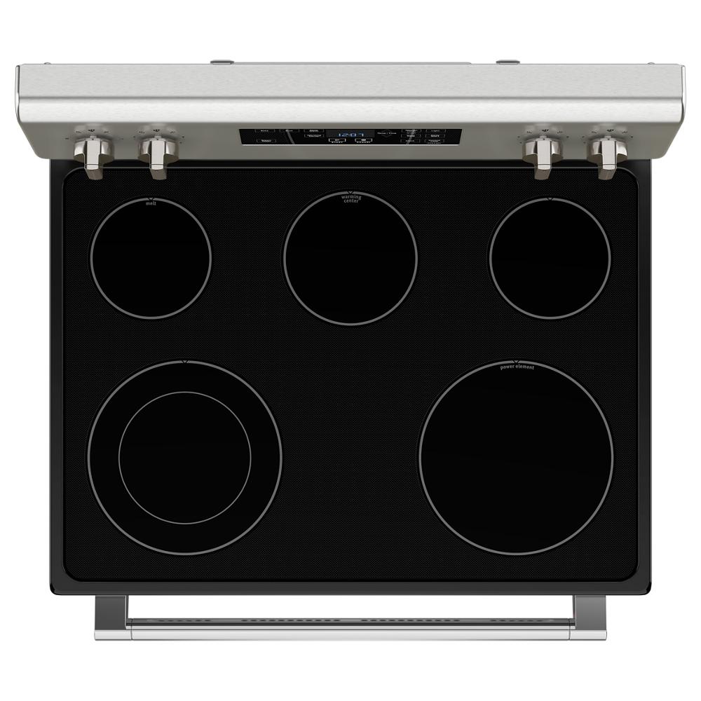 Black glass electric cooktop with five radiant heating elements and stainless steel control panel from kitchen appliances collection