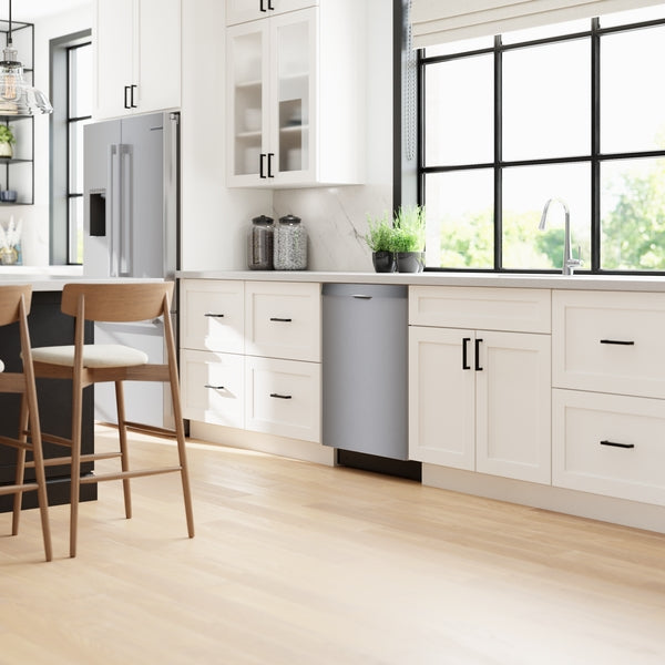 Modern kitchen with white cabinetry, large window, and integrated 24-inch stainless steel anti-fingerprint dishwasher from Bosch collection