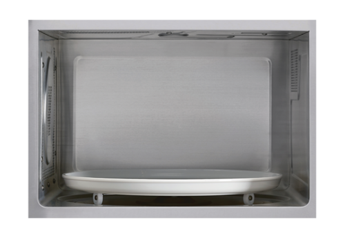 Interior view of a stainless steel countertop microwave oven with rotating glass turntable in appliances collection