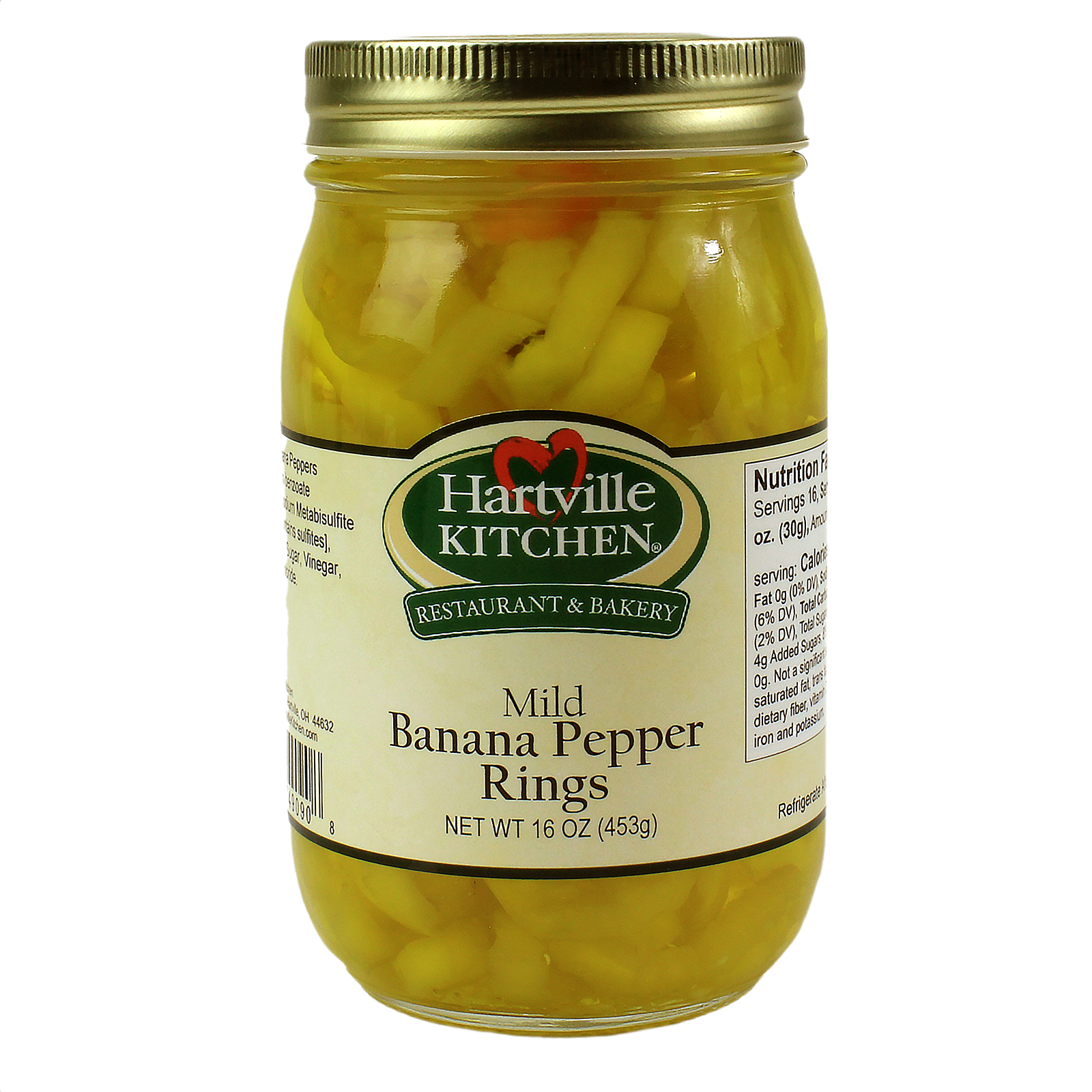 Glass jar filled with mild yellow banana pepper rings preserved in liquid with a gold metal lid