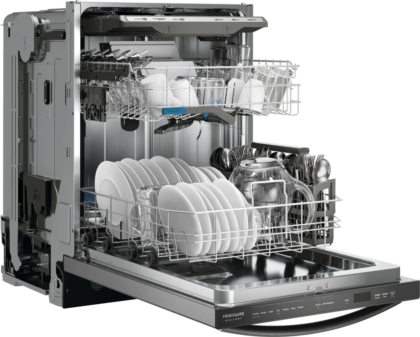 Open stainless steel tub built-in dishwasher loaded with plates, glasses, and utensils from kitchen appliances collection