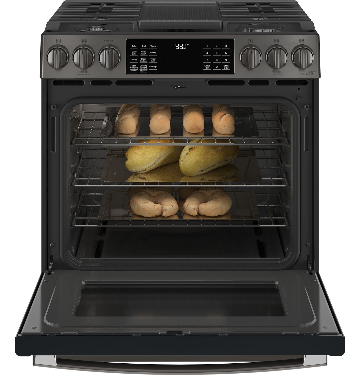 Dark stainless steel smart gas range with front controls, digital display, and open oven showing baked bread racks