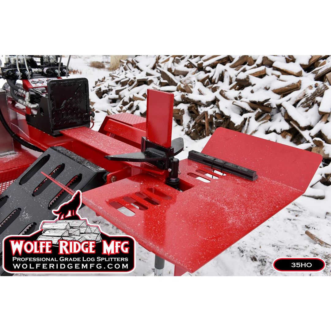 Red Wolfe Ridge 35 Ton log splitter wedge and platform outdoors with snow-covered firewood pile behind