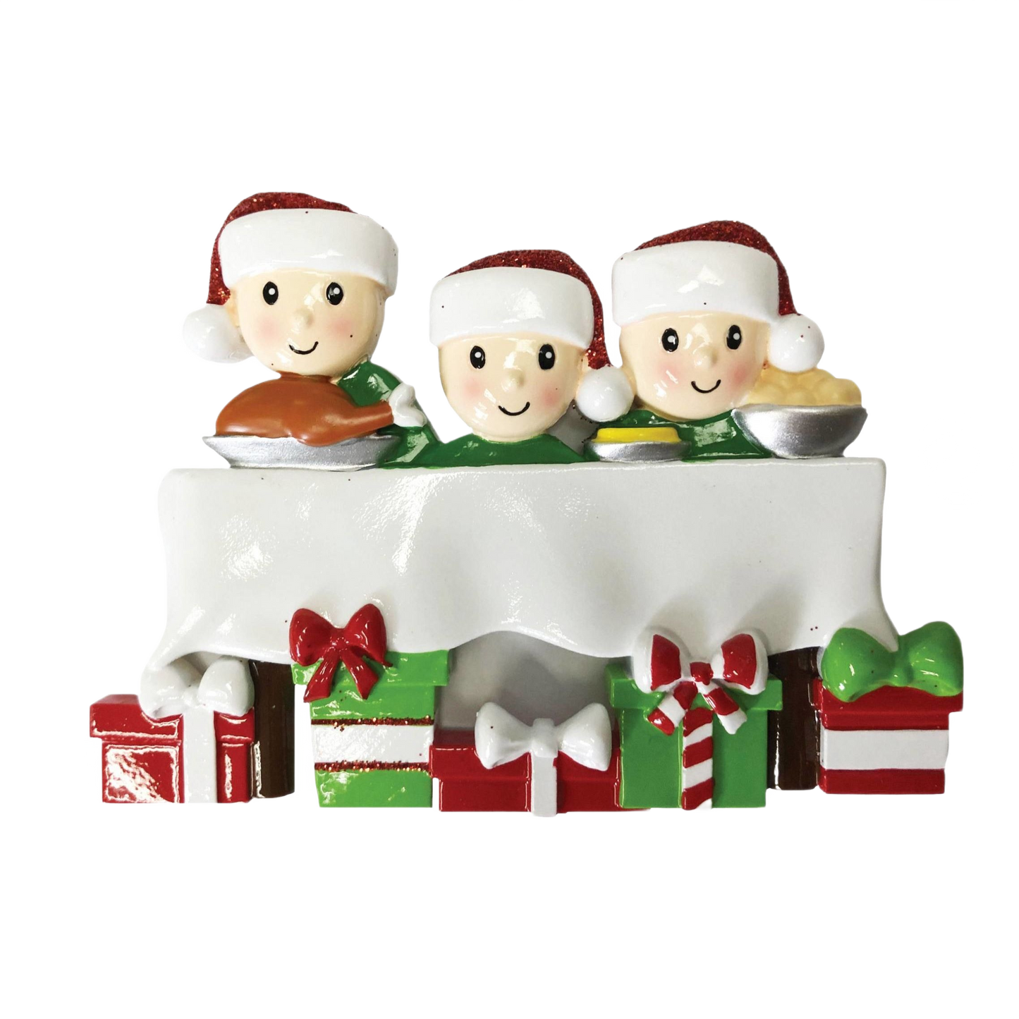 Three smiling figures in Santa hats behind festive dinner table with wrapped Christmas presents under it