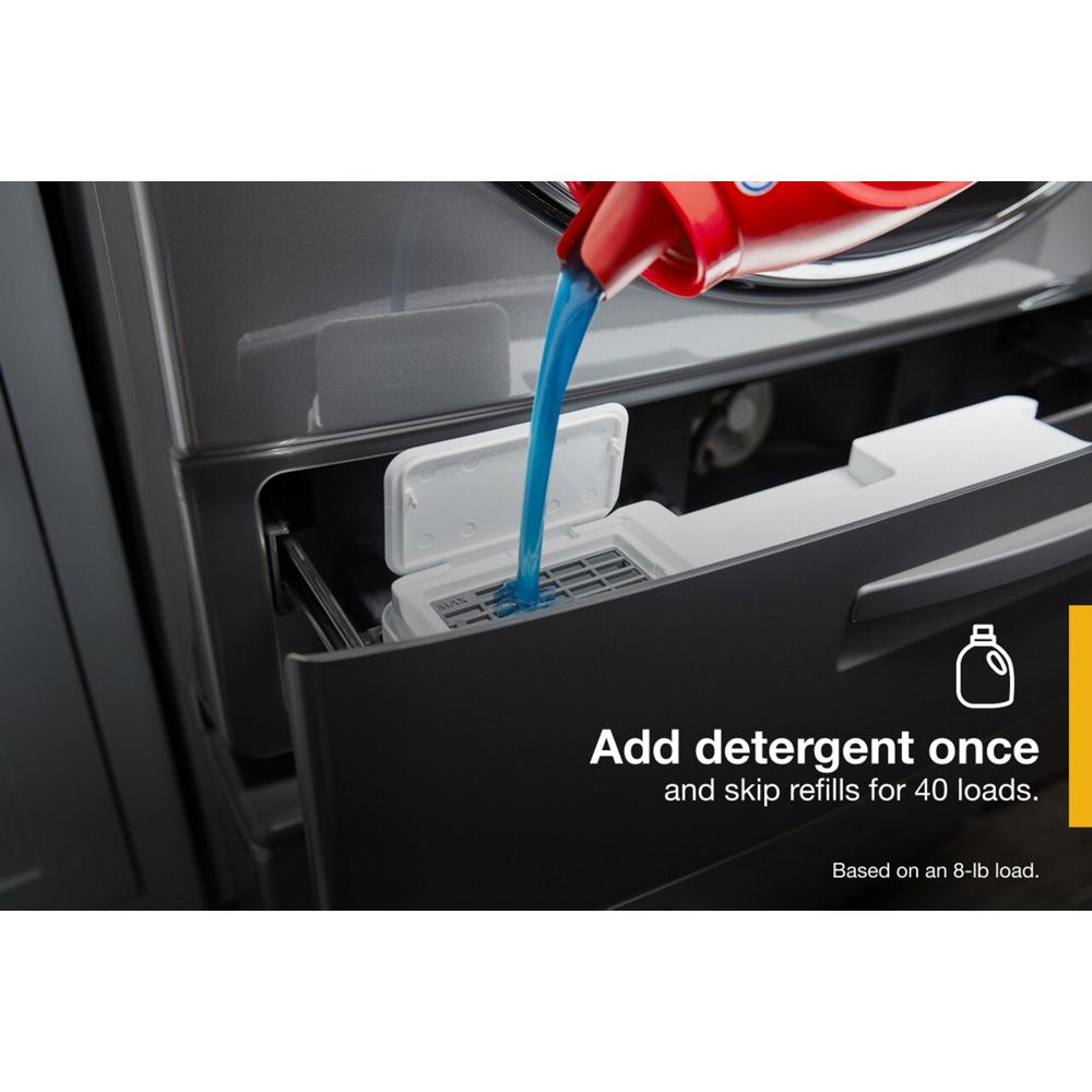 Blue liquid detergent being poured into a front load washer dispenser in washers and appliances collection