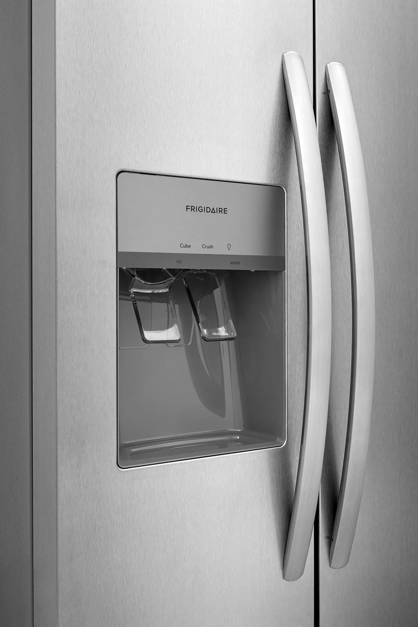 Close-up of stainless steel side-by-side refrigerator with built-in ice and water dispenser in appliances collection