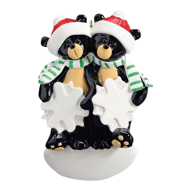 Black bear couple ornament with red Santa hats and green striped scarves holding glittery snowflakes from Christmas collection