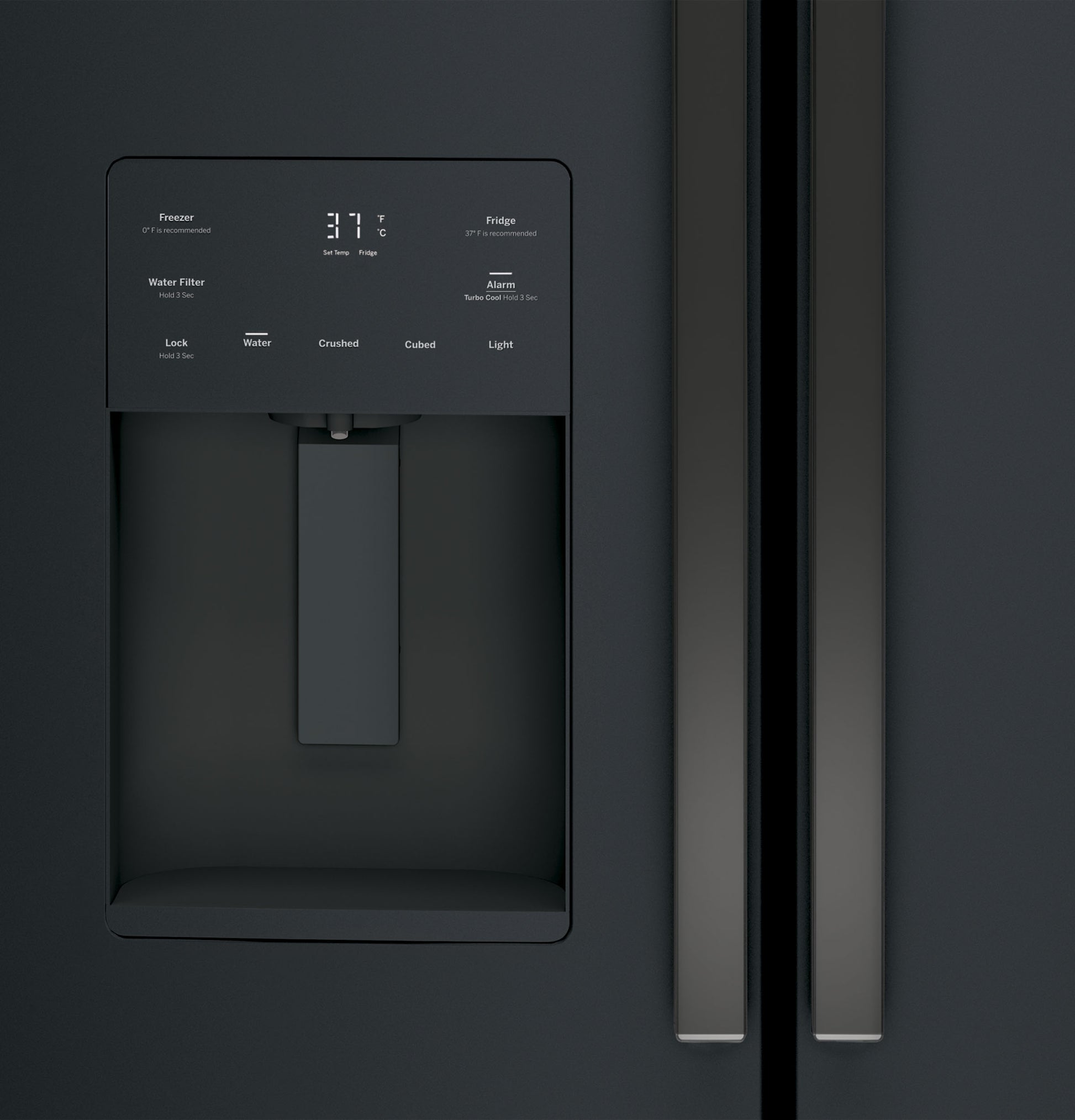 Close-up of black French-door refrigerator water dispenser with digital control panel and stainless steel handles
