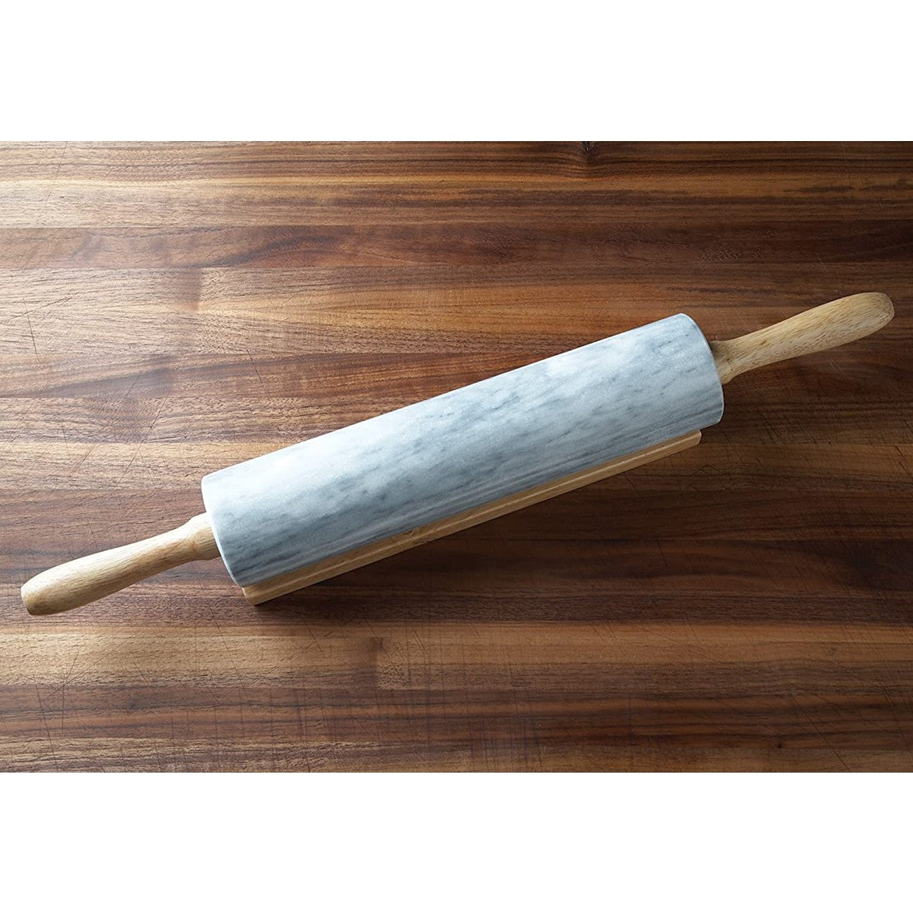 Marble rolling pin with wooden handles resting on wooden surface in Kitchenware and Bakeware collections