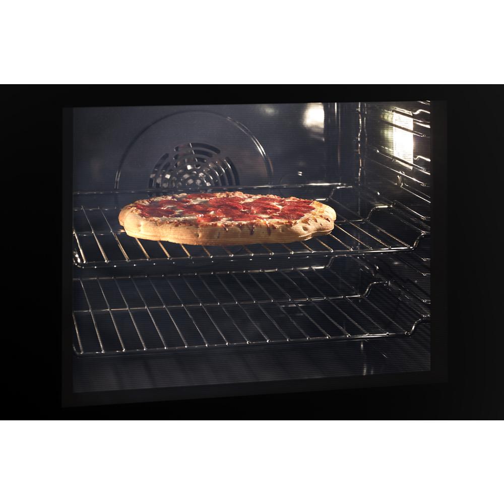 Inside view of a wall oven baking pepperoni pizza with convection fan visible in kitchen appliances collection