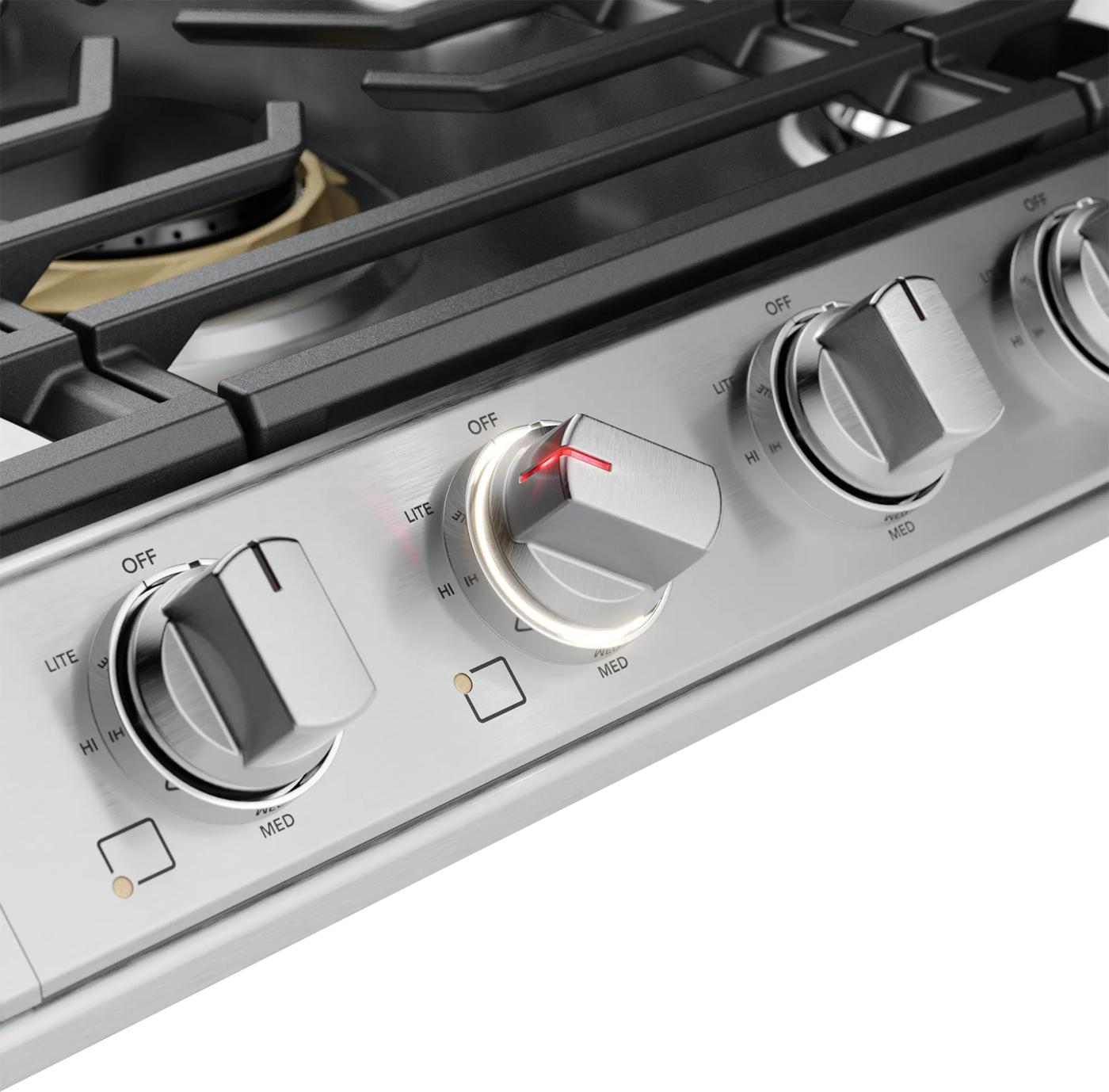 Close-up of a stainless steel gas cooktop control panel with four backlit LED knobs, part of Cooktops, Gas Cooktops, and Kitchen & Kitchenware collections.