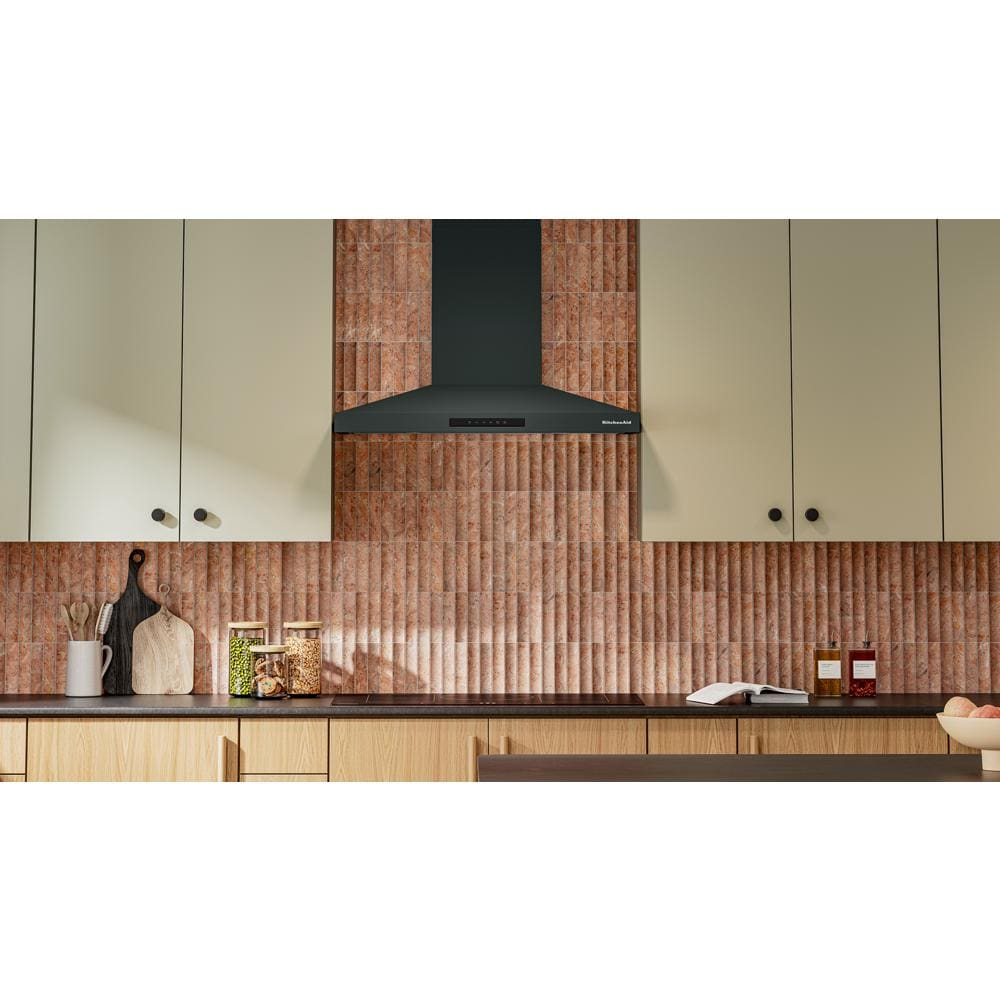 Matte black 36-inch wall-mount canopy hood with four-speed fan in modern kitchen from range hoods collection