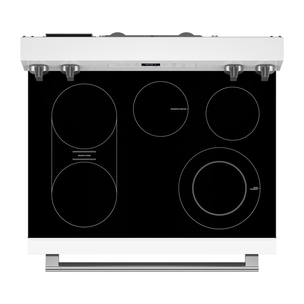 White electric range top view with smooth black glass cooktop, multiple heating zones, and stainless control knobs from Ranges collection