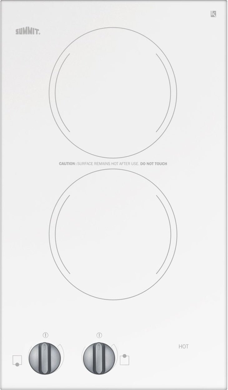 White radiant cooktop with two burner circles and dual control knobs in kitchen appliances and cooktops collection
