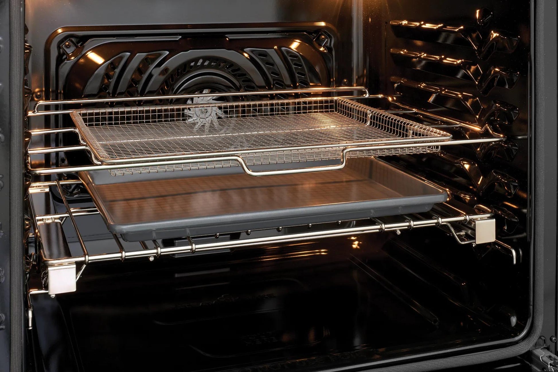 Open oven interior showing metal racks and air circulation fan designed for convection cooking modes