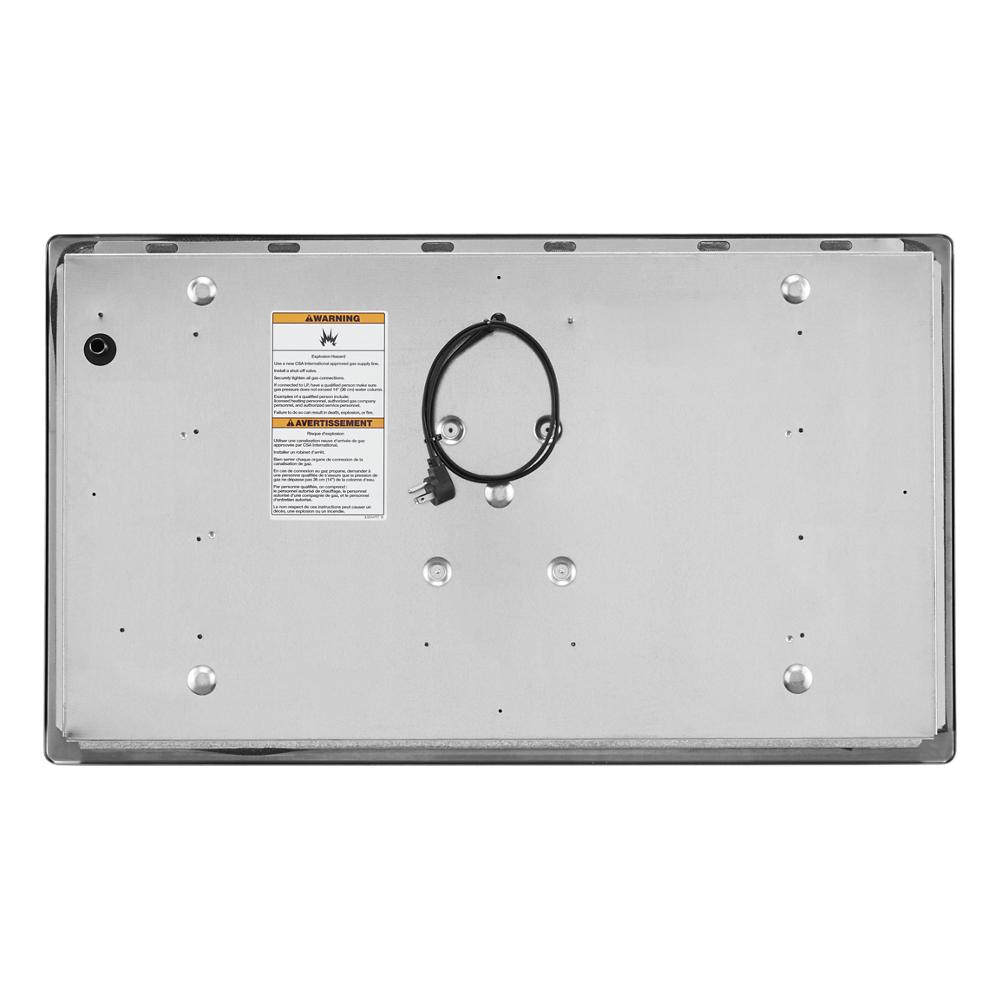 Underside view of stainless steel 36-inch gas cooktop with power cord and safety warning label for home installation