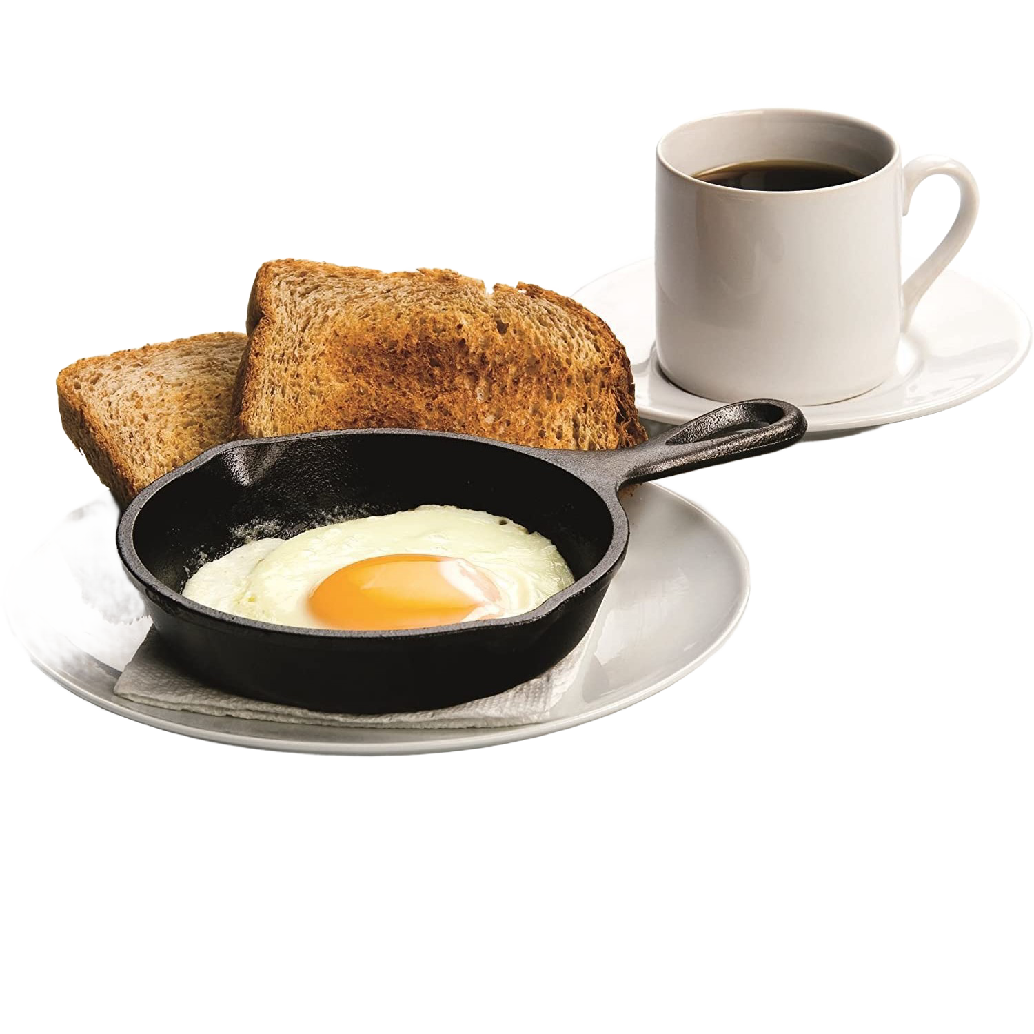 Small black cast iron skillet holding a cooked sunny-side-up egg with toast and coffee cup on white plate kitchenware setting