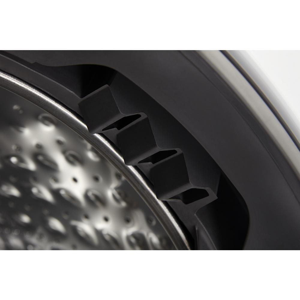 Close-up view of stainless steel drum and black rubber gasket of ventless washer dryer combo in appliances collection