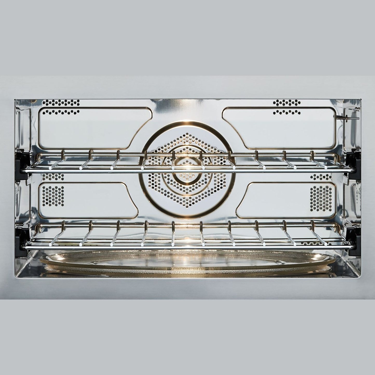 Interior view of stainless steel multifunctional oven with wire racks for kitchen and appliances collections