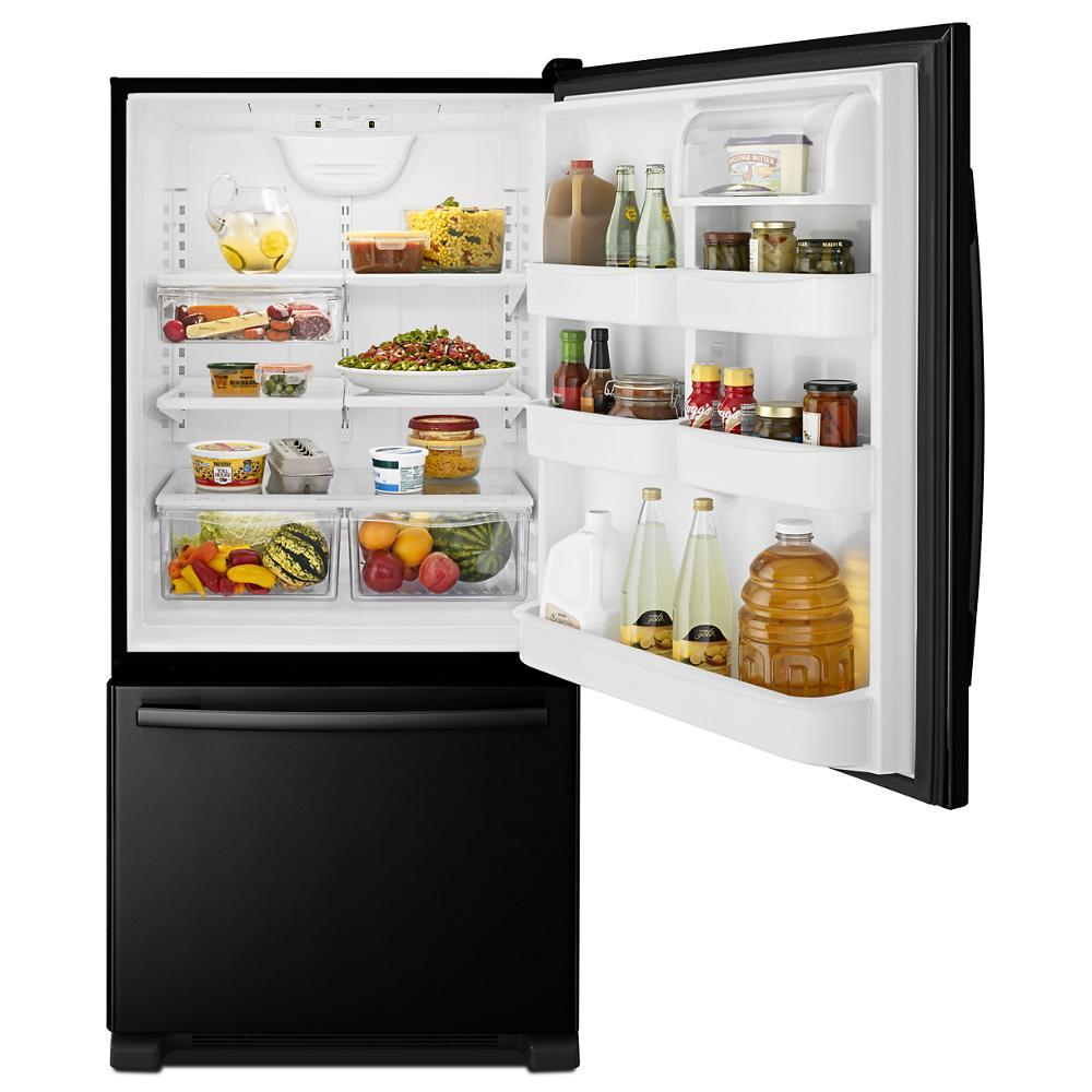 33-inch wide bottom-freezer refrigerator in matte black with open door showing adjustable door bins, clear shelving, and organized fresh and pantry items, part of Refrigerators, Kitchen & Kitchenware, All Products, Appliances collections.