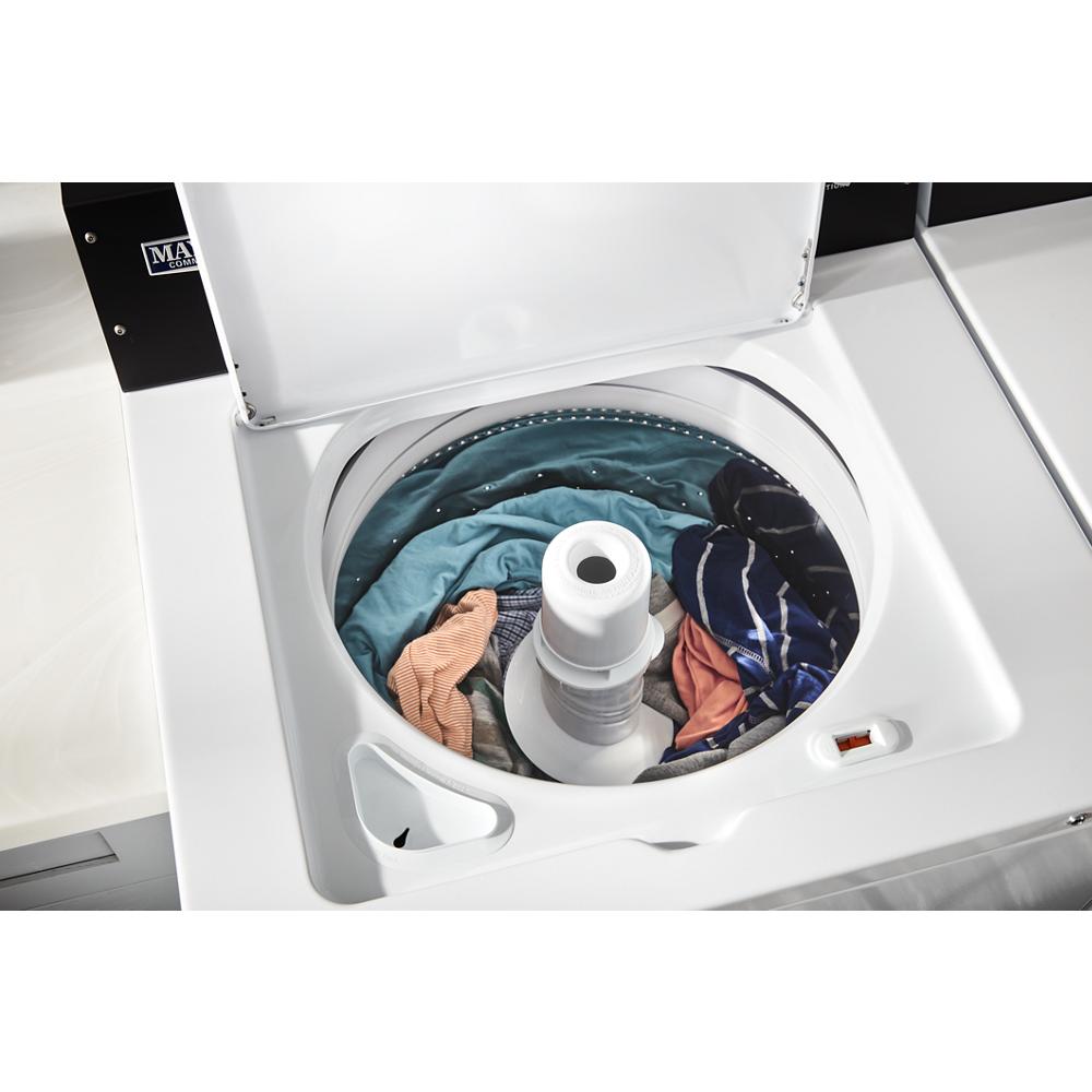 Top load washer with dual-action agitator and assorted laundry inside from washers and appliances collection