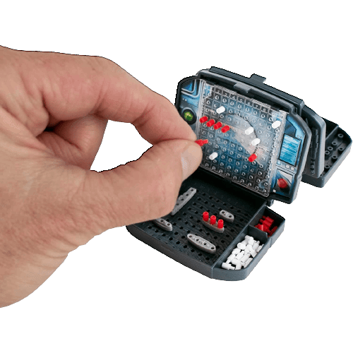 Hand placing a red peg onto a compact battle strategy game board resembling a small battleship for home entertainment.