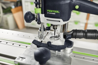 Close-up of a Festool router mounted on a guide rail for woodworking and power tool accessories collections