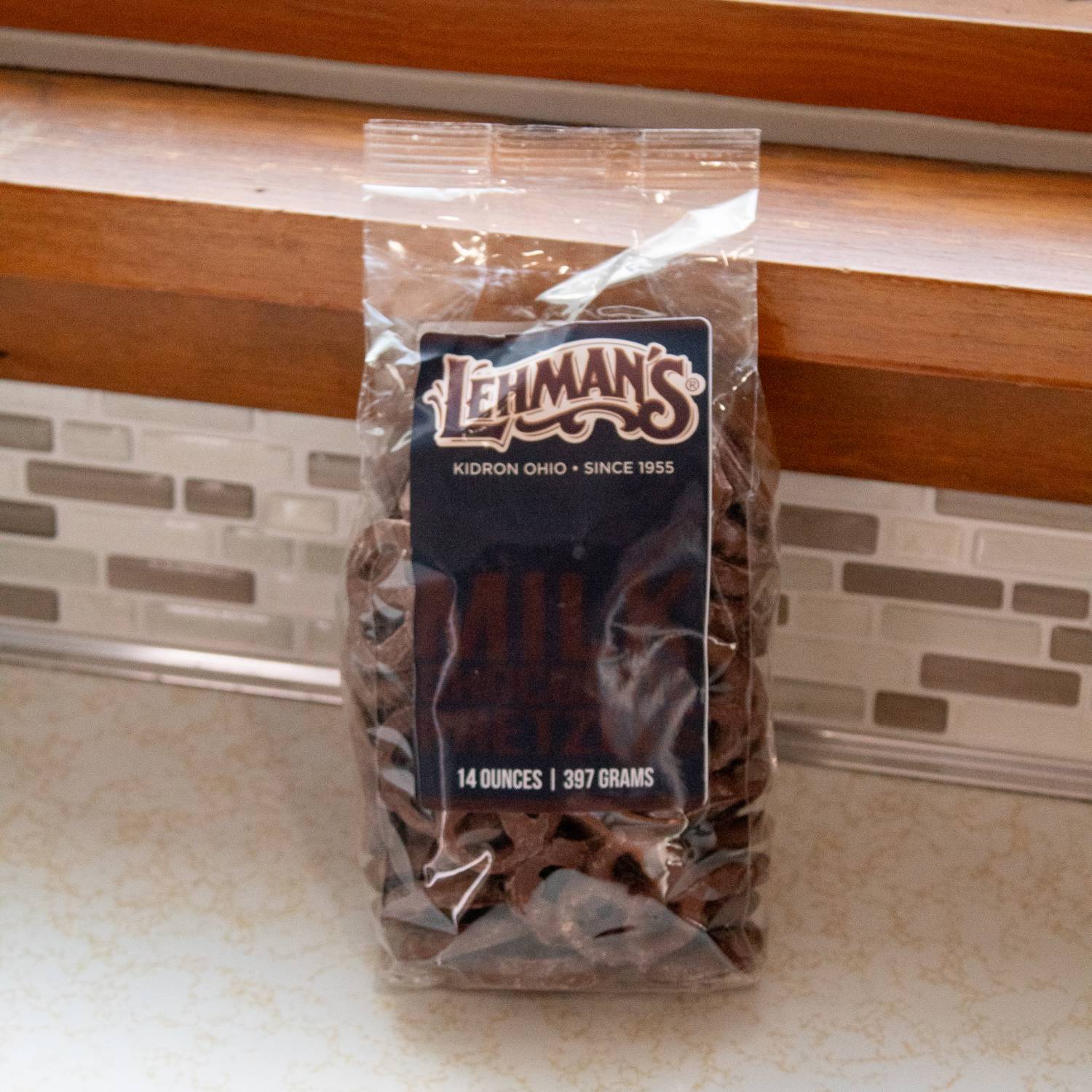 Clear plastic bag filled with chocolate coated pretzels in Chips & Snacks and Food & Beverage collections under $50