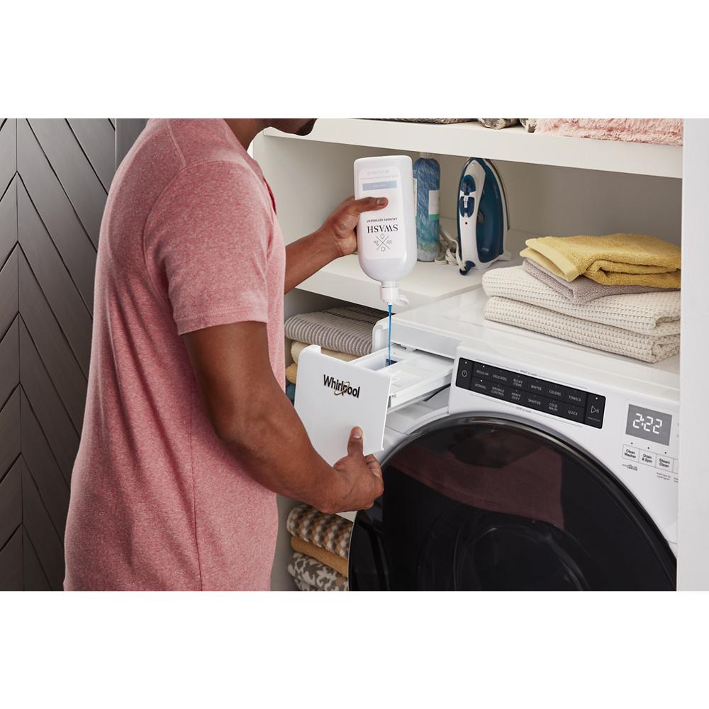 Person pouring liquid detergent into the dispenser of a white ventless washer dryer combo in a laundry room setting