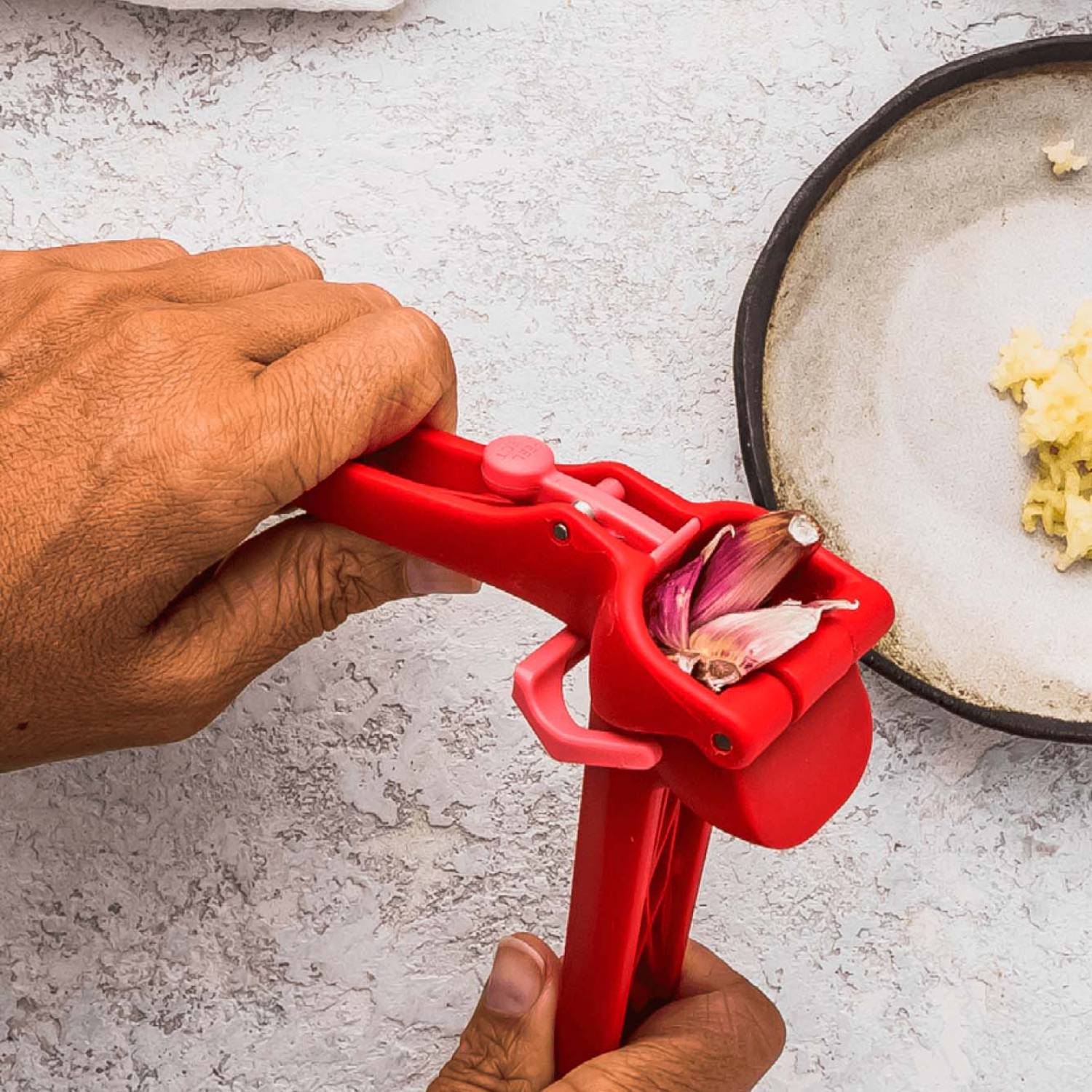 Red Garject Lite garlic press crushing garlic cloves with ergonomic design in kitchen utensils and gadgets collections