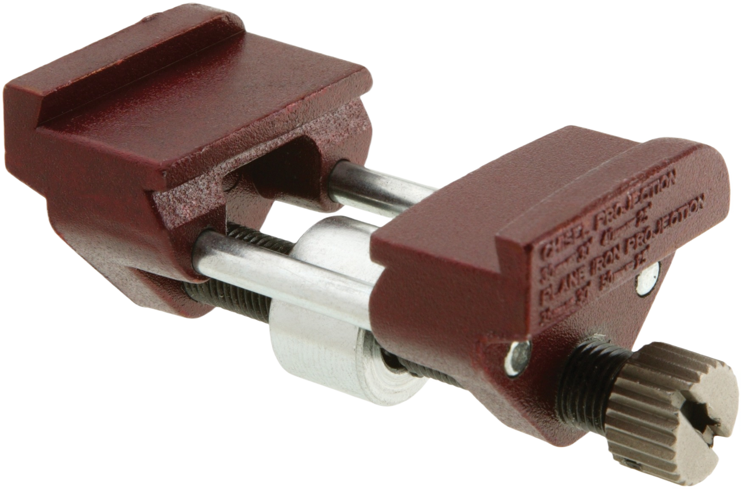 Compact honing guide with maroon cast iron body and adjustable steel rods for precise bevel sharpening in woodworking tools.