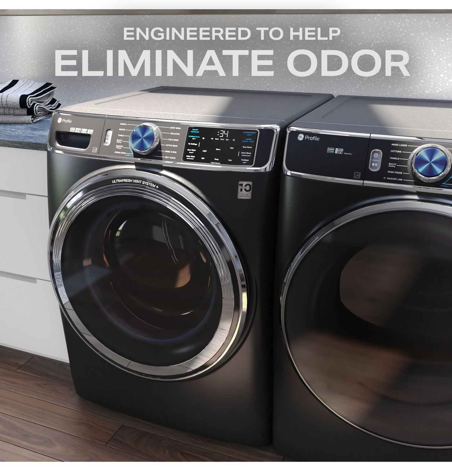 Black smart front load washer and dryer pair with digital controls in a modern laundry room setting