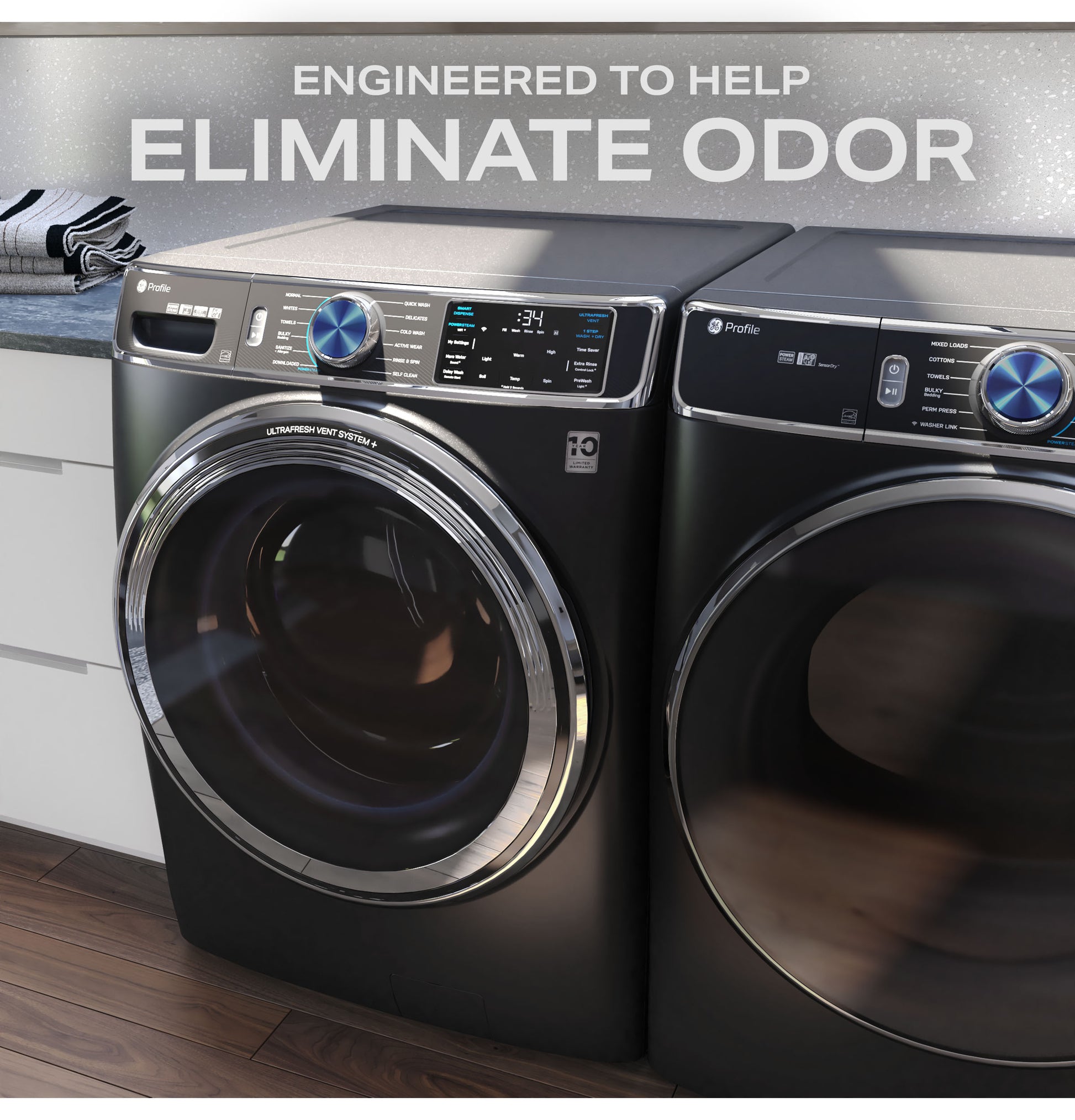 Black smart front load washer and dryer pair with digital controls in a modern laundry room setting